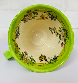 Image of Tall green figurative mug