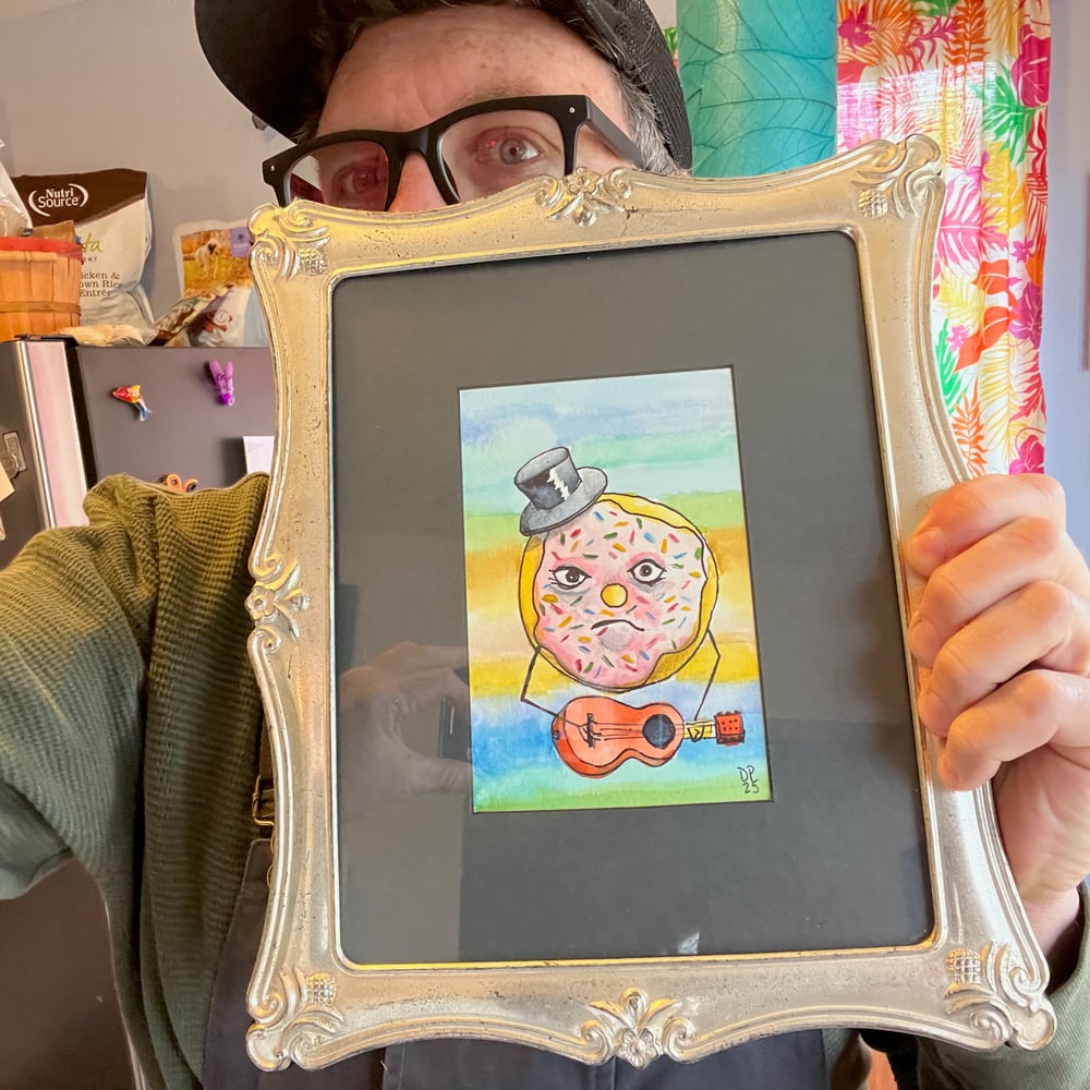 Image of Top Hat Donut Strummer