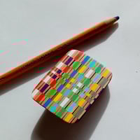 Op-Art pencil brooch