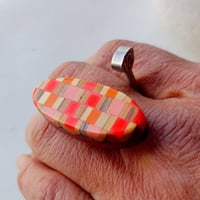 Image 1 of neon orange knitting needle ring