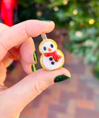 Red scarf snow person 