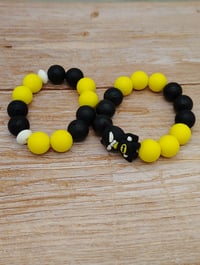 Image 5 of Black and yellow silicone beaded superhero charm bracelet for women teens and girls