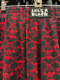Image 1 of 1980s Life’s A Beach Rare Skull Black & Red Size Sm/ Medium Pants