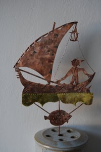 Image 1 of Boy in a sailboat