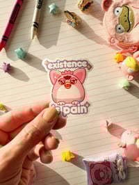 Image 1 of Ultra Glossy Glitter Furby Existence is Pain Vinyl Sticker