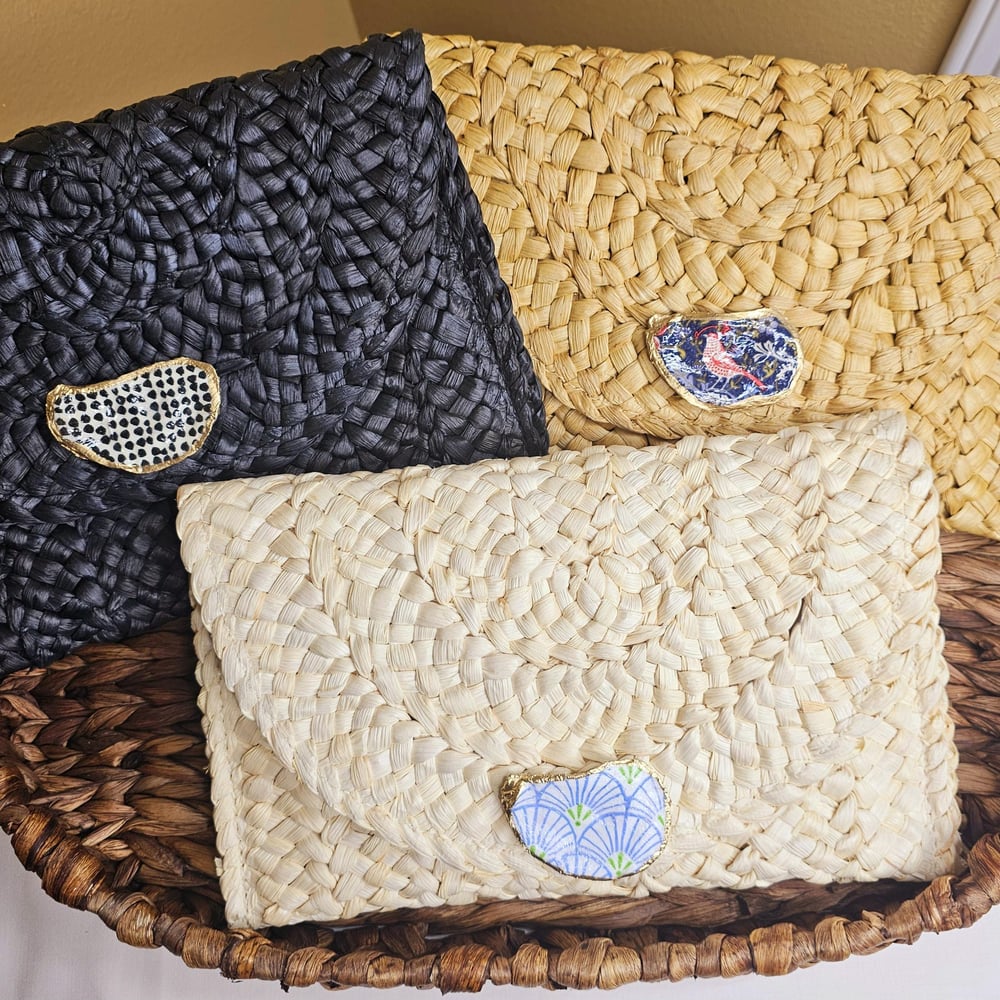 Image of Handwoven Straw Clutch with Oyster Shell Accent &amp; Pom-Pom Charm | Boho Chic Handbag