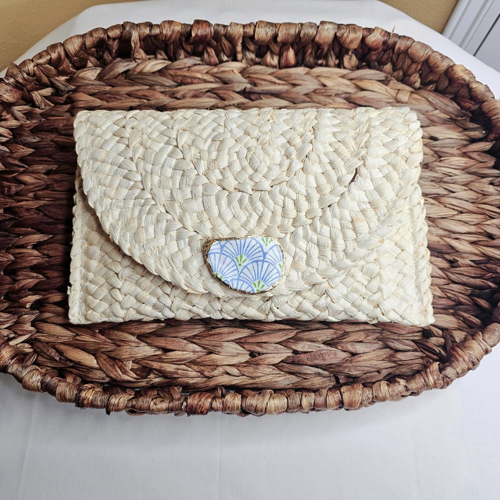 Image of Handwoven Straw Clutch with Oyster Shell Accent &amp; Pom-Pom Charm | Boho Chic Handbag