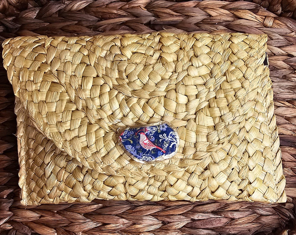 Image of Handwoven Straw Clutch with Oyster Shell Accent &amp; Pom-Pom Charm | Boho Chic Handbag