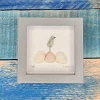 Seaglass bird on shells