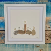 Seaglass birds on beach pebbles