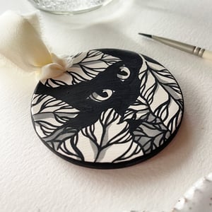 Image of Hiding Spot, hand-painted ceramic bisque ornament