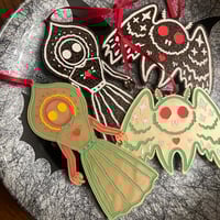 Image 1 of cryptid cookie ornaments 