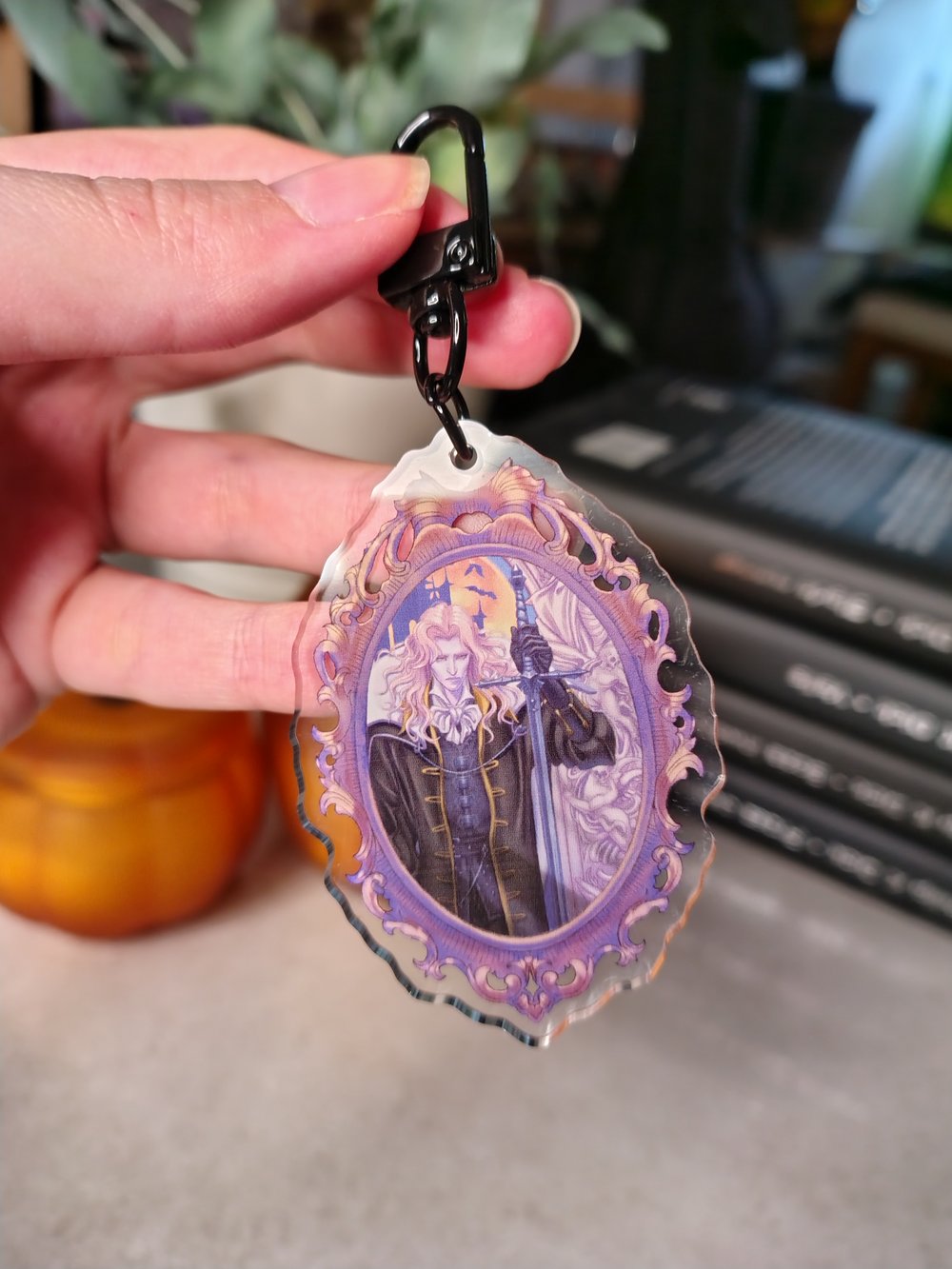 Image of Alucard in frame clear acrylic charm