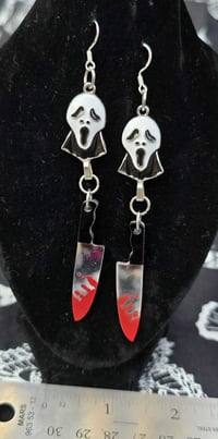 scream face guy dangle earrings