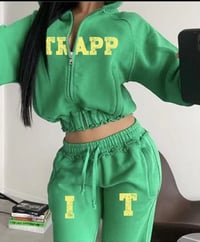 Image 1 of Womans green and yellow itrapp sweat suit.