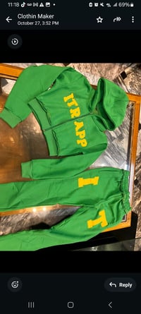Image 2 of Womans green and yellow itrapp sweat suit.