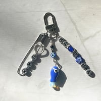 Image 1 of SKZ KARMA Keychain | Blue Evil Eye & Fish Charm Keychain