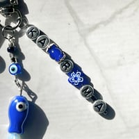 Image 4 of SKZ KARMA Keychain | Blue Evil Eye & Fish Charm Keychain