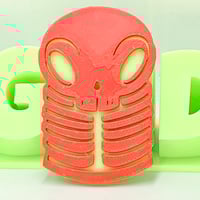 Image 3 of 3in skelly token - red/green