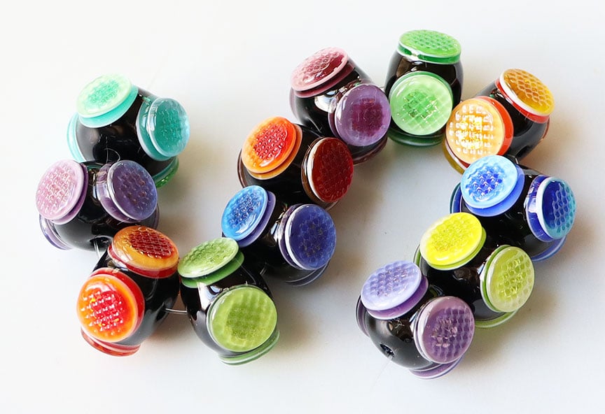 Rainbow Flames Fly-Eye Rondells - 12 quite colorful beads