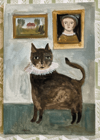 Cat on a green table with paintings by Cathy Cullis
