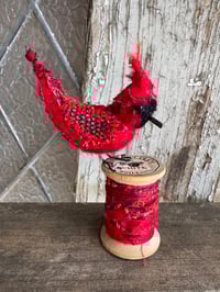 Image 1 of Large cardinal on spool 