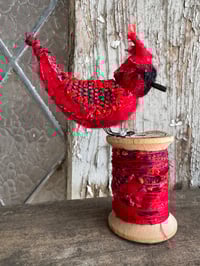 Image 2 of Large cardinal on spool 