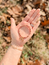 Mauve Stone & Droopy Brown Bow