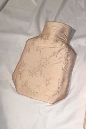 Image of Silk covered hot water bottle