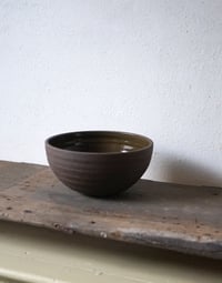 Image 1 of Medium black Bowl green glaze inside 