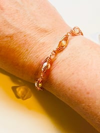 Image 1 of wire wrapped pearl and copper bracelet