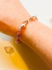 Image 2 of wire wrapped pearl and copper bracelet