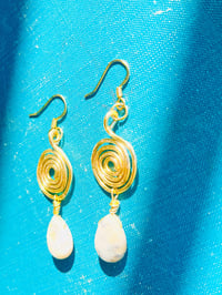 Image 2 of gold spiral earrings with sage amethyst drops