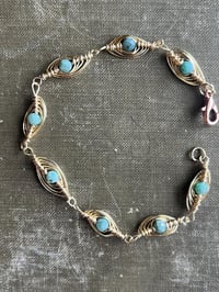 Image 2 of wire wrapped gold and emerald bracelet