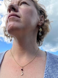 Image 7 of gold crescent moon necklace with red garnet