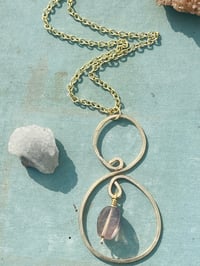 Image 3 of gold hammered spiral necklace with tiny purple fluorite stone