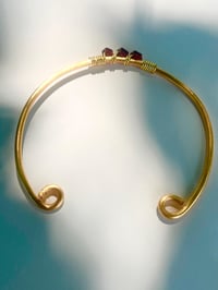 Image 4 of dark red garnet bangle in gold