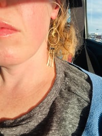 Image 4 of dangly gold moon earrings with lapis lazuli