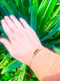 Image 7 of dark red garnet bangle in gold