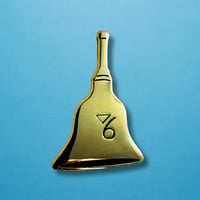 Image 1 of Gladys's Golden Bell Enamel Pin