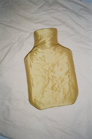 Image of Silk covered hot water bottle