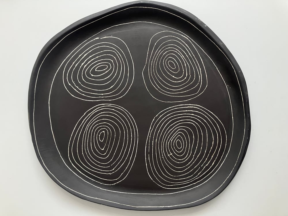 Image of four circles black stoneware platter