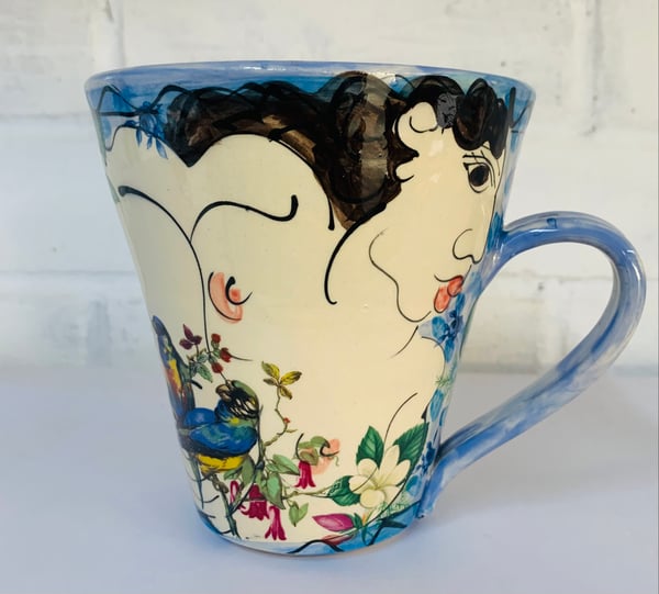 Image of Tall sky blue figurative mug