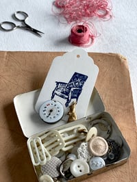 Little metal tin with beautiful things 