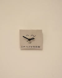 ‘Smileeeee’ clock 