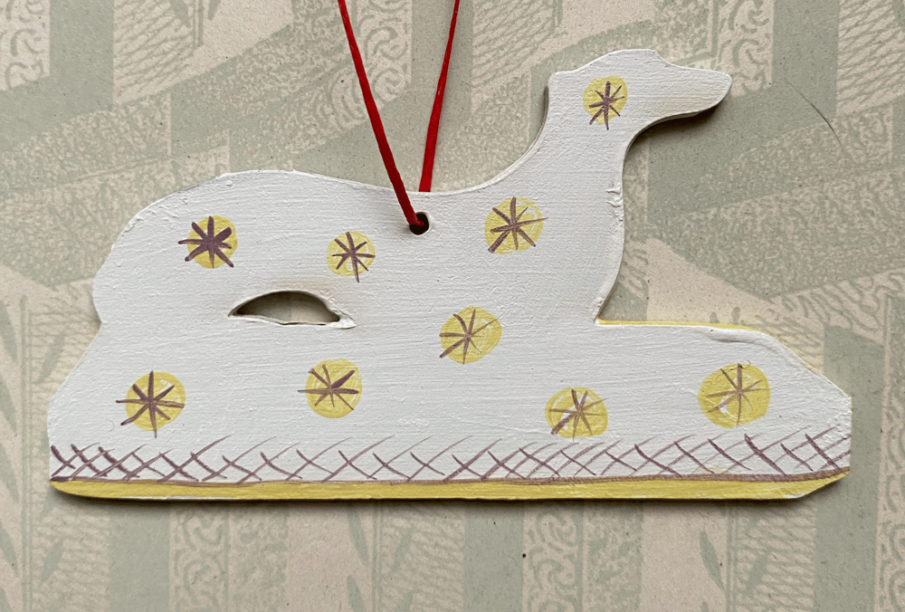 Image of Small dog decoration (B) left facing.