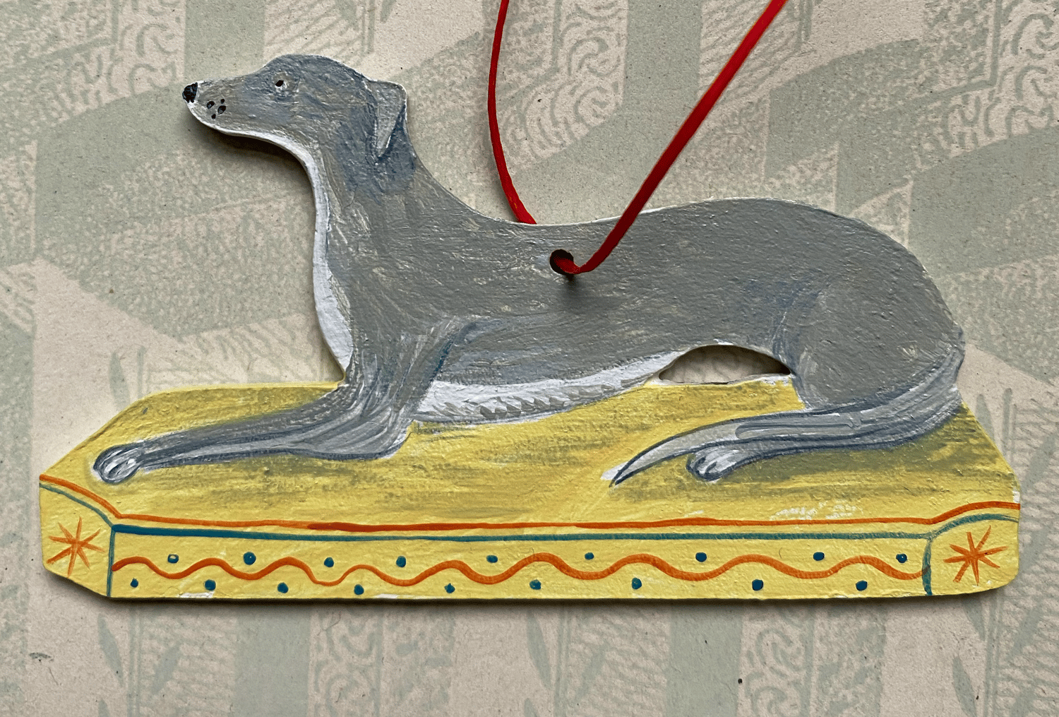 Image of Small dog decoration (B) left facing.
