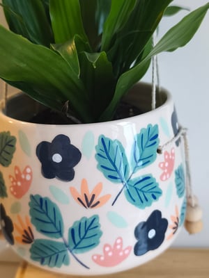 Image of    Pot suspendu petite fleur bleue 