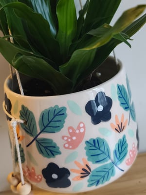 Image of    Pot suspendu petite fleur bleue 