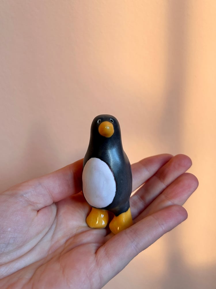 Image of ceramic penguin sculptures